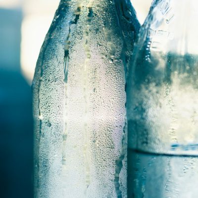 clear glass bottle with water