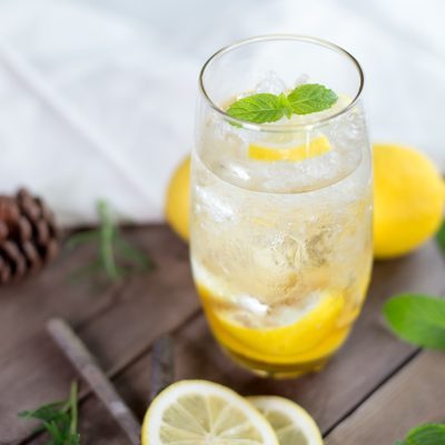 clear drinking glass with yellow liquid