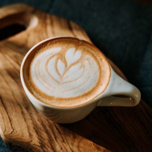 white ceramic mug with brown and white liquid